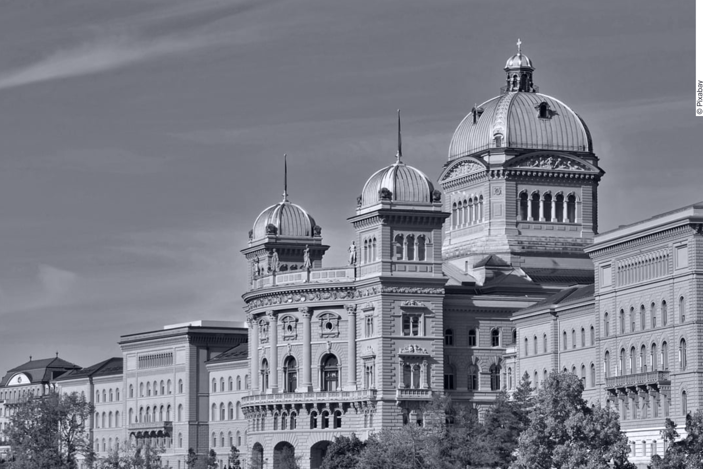Black and white photo of the Federal Palace in Bern, Switzerland.